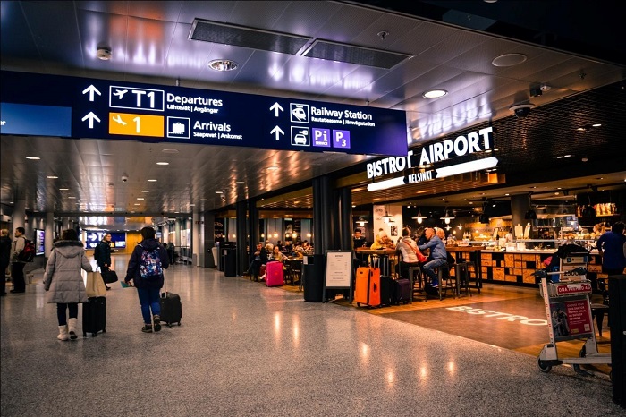 People walk by Shops at Airport