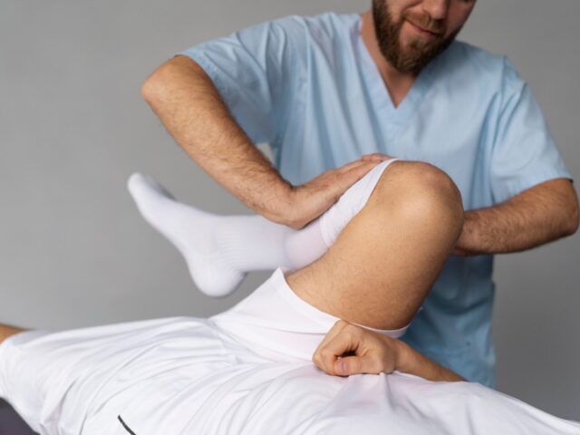 physiotherapist-helping-patient-front-view